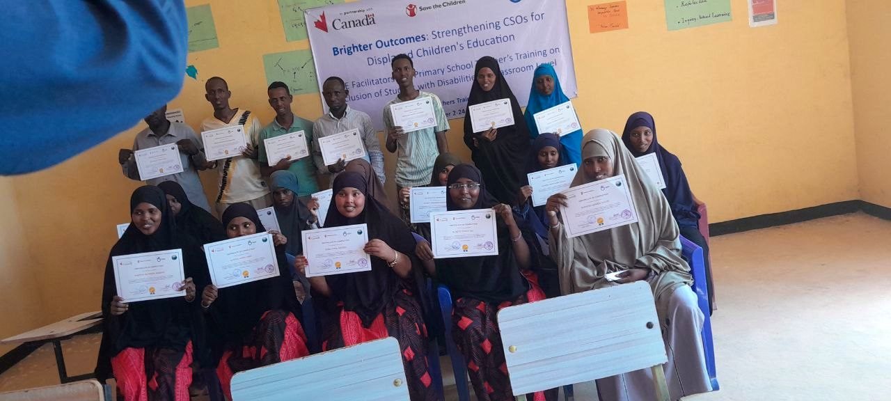 Community members receiving certificates at a Brighter Outcomes Ethiopia training
