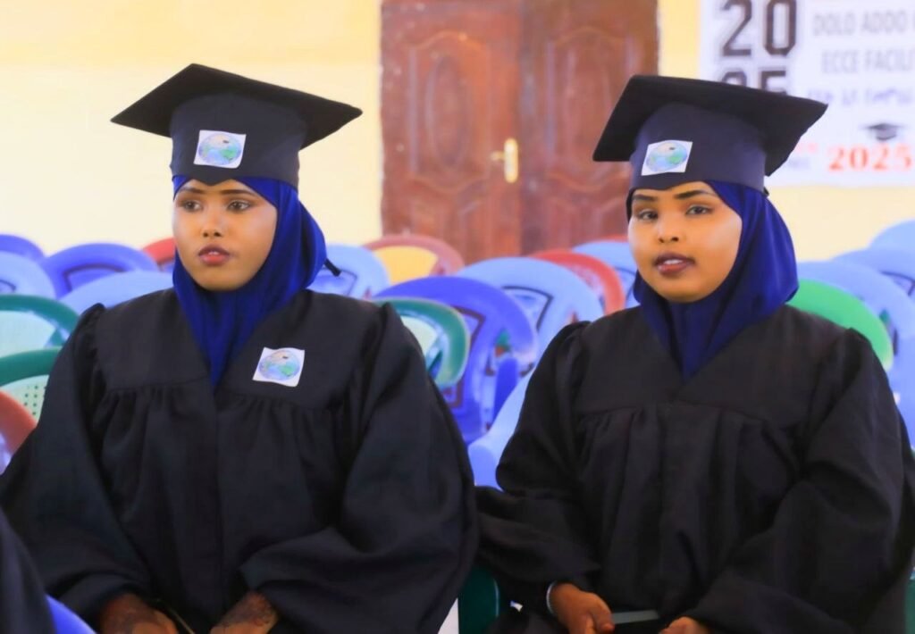 Two women teachers in cap and gown at the Dollo Ado Teachers Training College graduation