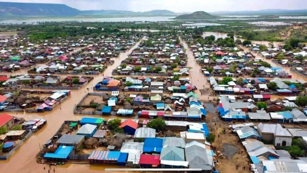 Aerial view of flood water running through a settlement in the Dollo area, part of the area affected by seasonal flooding that Wa-PYDO responded to.